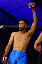 michalel martinez with his hand raised