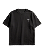 Black t-shirt with a white cross design on a concrete floor background